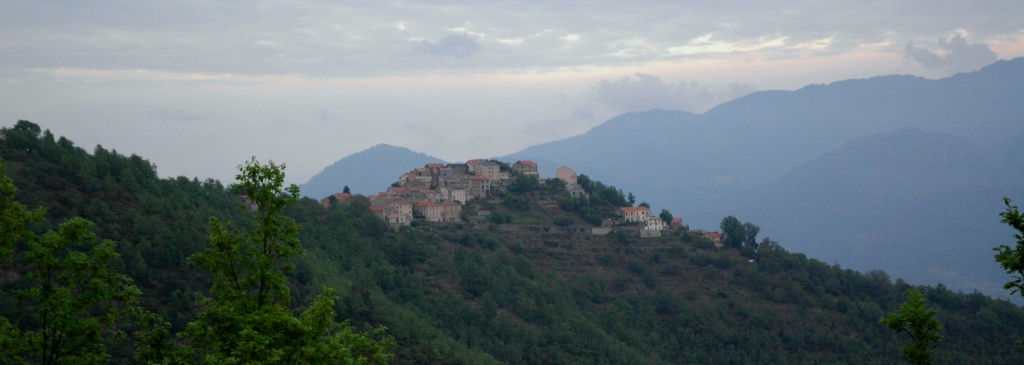 Mountain small village under clouds