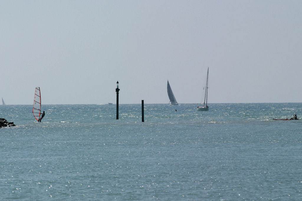 The surfer, the boats, the canoe
