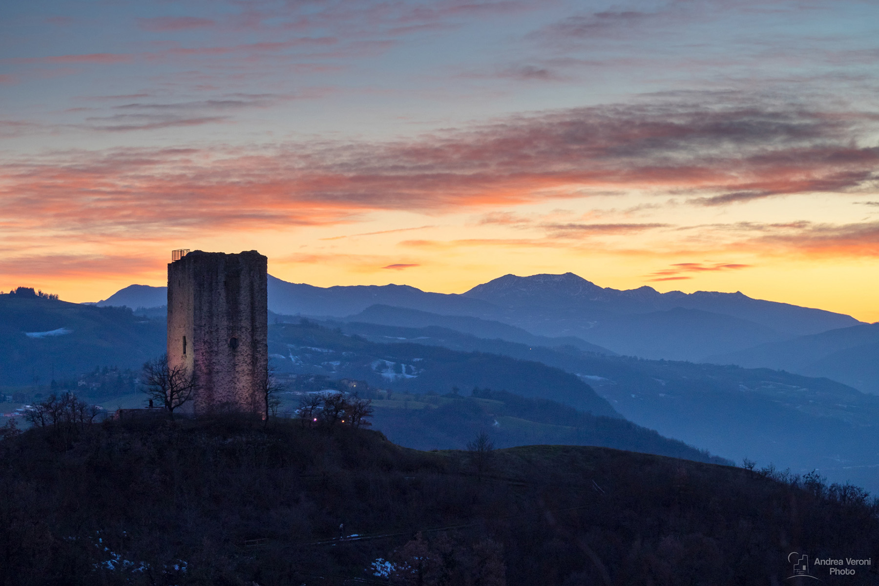 Suset behind the old tower