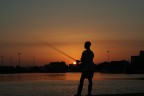 porto di cagliari al tramonto...un pescatore..