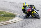 Un bambino in sella ad una strana moto in un kartodromo...
... ma che pieghe...

Massimiliano
